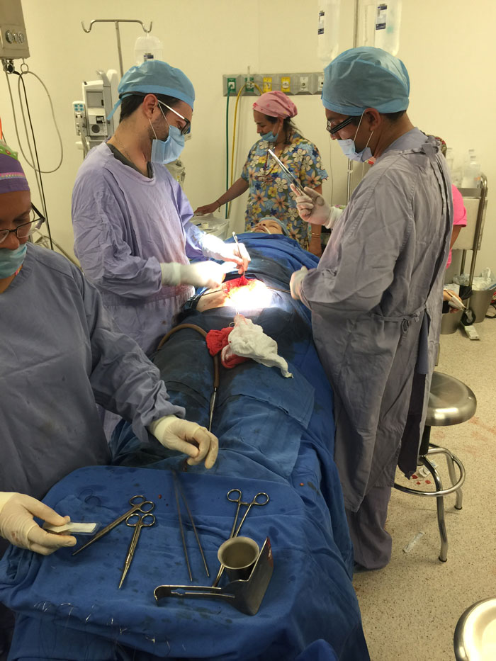 Image of operation with doctors and patient